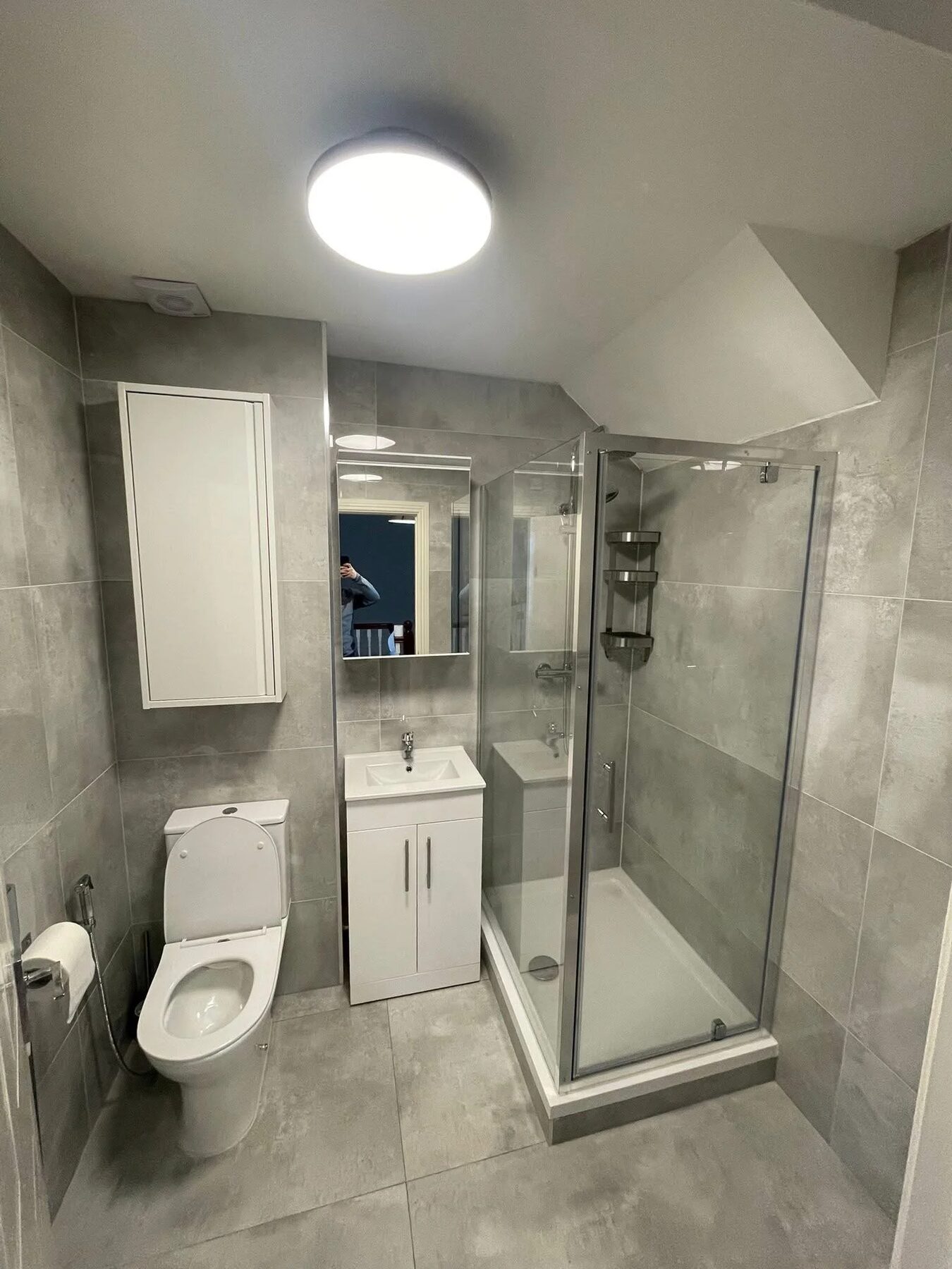Compact shower room refit in a Dublin home with shower, WC and storage